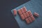 Sweet swiss chocolate candies on a stone tabletop, flatlay