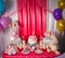 Sweet table and big unicorn cake for baby girl first birthday. Candy bar with a lot of different candies and sweet cakes