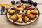 Sweet tart with peaches, plums and blueberries