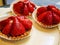 Sweet tartlets with fresh strawberries in a pastry shop