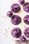 Sweet and tasty cupcakes made of purple whipped cream
