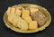 Sweet And Tasty Mixed Cookies or Biscuits Served in Golden Plate