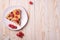 Sweet tasty pie slice with jellied and fresh raspberry fruits in plate, wooden table background