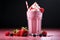 Sweet temptation Cold pink milkshake, a luscious blend of strawberry goodness