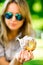 Sweet temptation, woman is showing piece of Trdelnik