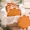 Sweet thin ginger biscuit in gift box on a wooden background. Festive pastry.