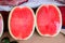 Sweet water melon, some cut half. watermelon at market. Fresh organic watermelons on a marketplace.