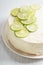 Sweet white buttercream cake with sliced lime on top