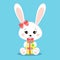 Sweet white easter rabbits girl holding gift egg