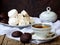 Sweet white Russian marshmallow, chocolate zephyr, meringue, apple pastila and cup of coffee on wooden background.