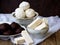 Sweet white Russian marshmallow, chocolate zephyr, meringue, apple pastila on wooden background.