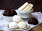 Sweet white Russian marshmallow, chocolate zephyr, meringue, apple pastila on wooden background.