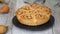 Sweet yeast buns with pear filling on rotating table. Autumn baking.