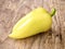 Sweet yellow bulgarian pepper. On wooden background