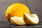 Sweet yellow fresh melon on wooden table