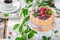 Sweet yoghurt cake with raspberries and blueberries in garden