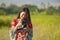 Sweet young Asian Chinese or Korean woman on her 20s checking picture in photo camera in beautiful nature landscape in holidays