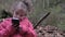 Sweet young happy five-year-old little girl uses smart phone in beutiful nature