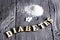 Sweetener tablet and sugar. Text diabetes wooden letters.