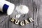 Sweetener tablet and sugar. Text sugar wooden letters.