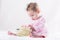 Sweetest baby girl playing with a huge white flower