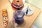 Sweets, cake, bread, juice, flowers and glass cups on a table