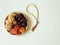 Sweets, dates, dried apricots on a plate on a beige background.