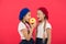 Sweets shop and bakery concept. Kids huge fans of baked donuts. Share sweet donut. Girls in beret hats hold glazed donut