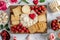 Sweets and strawberries on a festive table setup with a romantic touch highlighted by a heart-shaped accent, perfect for