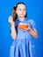 Sweets the only true love. Sweet tooth concept. Calorie and diet. Girl calm face blue dress hold bowl sweets