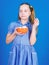 Sweets the only true love. Sweet tooth concept. Calorie and diet. Girl calm face blue dress hold bowl sweets