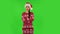 Sweety girl in Santa Claus hat is listening to boring information. Green screen