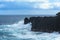 Swell rolling over volcanic rocks at Reunion Island