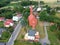 Swieszyno city, aerial view on main road, buildings and red brick church