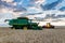 Swift Current, SK/Canada- Aug 25, 2019: Sunburst over combine at harvest