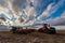 Swift Current, SK/Canada- May 9, 2020: Vast sunset sky over Case tractor and Bourgault air drill seeding equipment