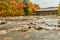 Swift River and old covered bridge at autumn