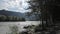 Swift water flow in mountain river, rocks along the river bank