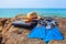 Swim flippers, mask, snorkel,hat,laptop on rock beach sea and b