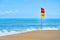 Swim here, Safety flag on the sea beach. flag with text swimming here on the beach. swim zone for safety. Safety zone for swimming