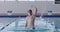 Swimmer coming out of the water and raising arm