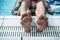Swimmer foot on the edge of the swimming pool