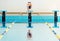 Swimmer jumping from starting block