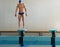 Swimmer standing on starting block