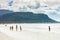 Swimmers frolicking in the shallow waves of Fish Hoek beach