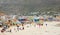 Swimmers frolicking in the shallow waves of Fish Hoek beach