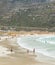 Swimmers frolicking in the shallow waves of Fish Hoek beach