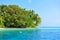 Swimmers snorkelling at the beach next to a Maldivian island