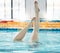 Swimming, athlete and legs upside down, ballet exercise and training for healthy body wellness. Pool, feet and person in