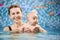 Swimming classes for little ones, infant with mother in swimming pool during training